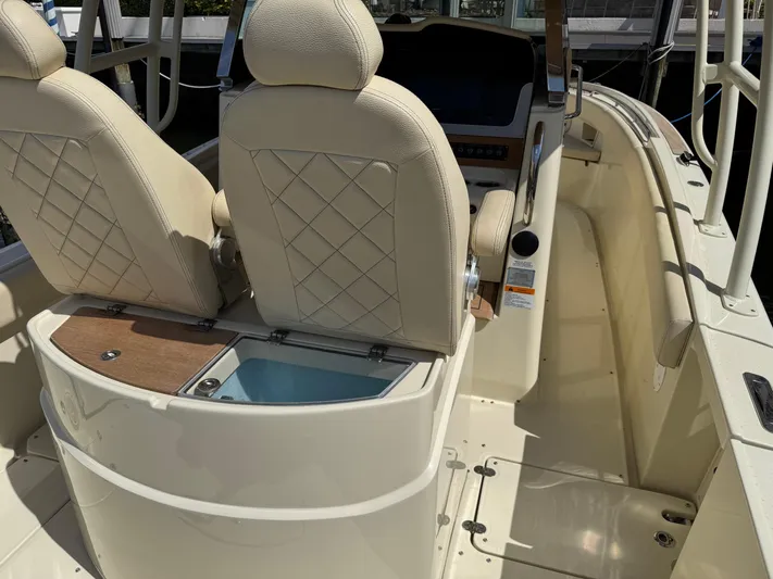  Yacht Photos Pics 2018 Chris-Craft Catalina 30 boat interior with beige seats and console.