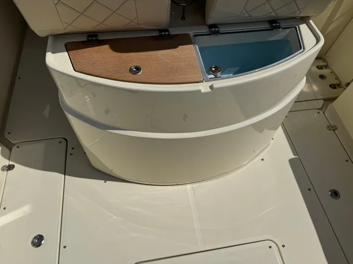  Yacht Photos Pics 2018 Chris-Craft Catalina 30 boat interior with storage compartments and cushioned seating.