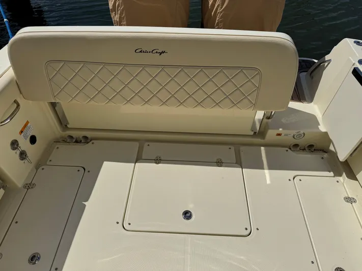  Yacht Photos Pics 2018 Chris-Craft Catalina 30 boat deck with cushioned seating and storage compartments.