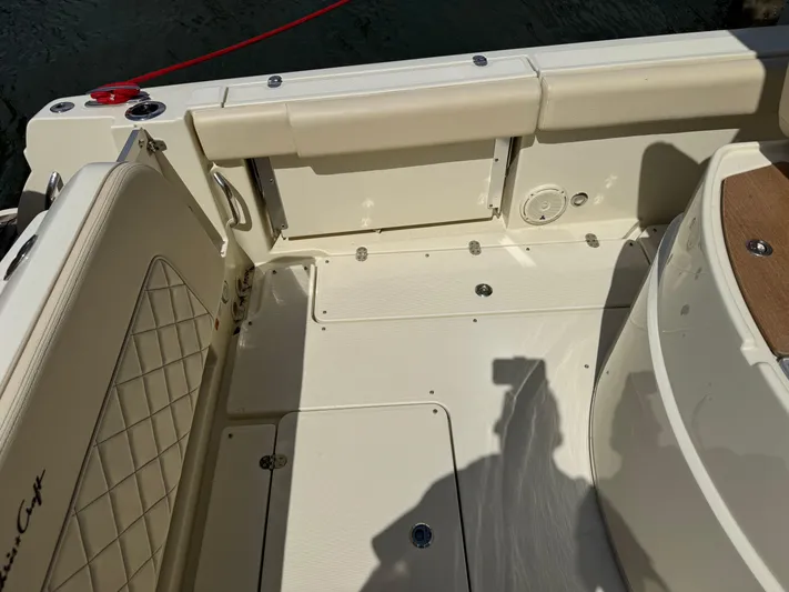  Yacht Photos Pics 2018 Chris-Craft Catalina 30 boat interior with beige seating and deck details.