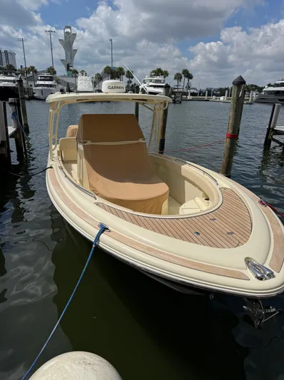  Yacht Photos Pics 2018 Chris-Craft Catalina 30 boat docked in a marina under a partly cloudy sky.