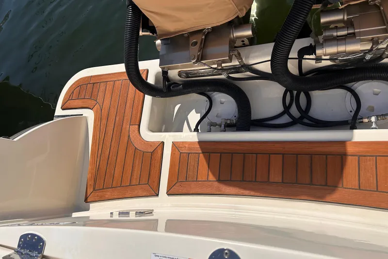  Yacht Photos Pics 2018 Chris-Craft Catalina 30 boat deck with teak flooring and engine components.