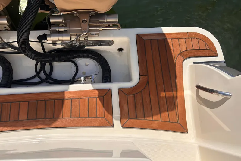  Yacht Photos Pics Teak deck of 2018 Chris-Craft Catalina 30 boat, featuring elegant wood finish and hardware.