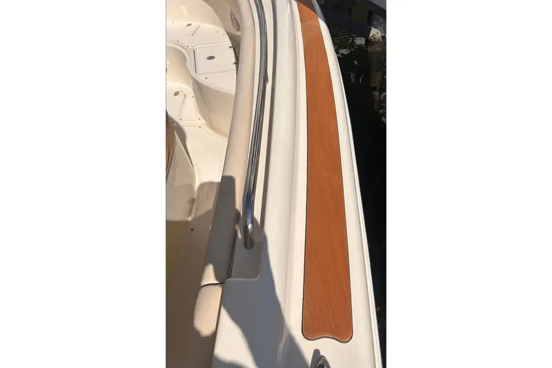  Yacht Photos Pics 2018 Chris-Craft Catalina 30 boat deck with wood and metal railing detail.