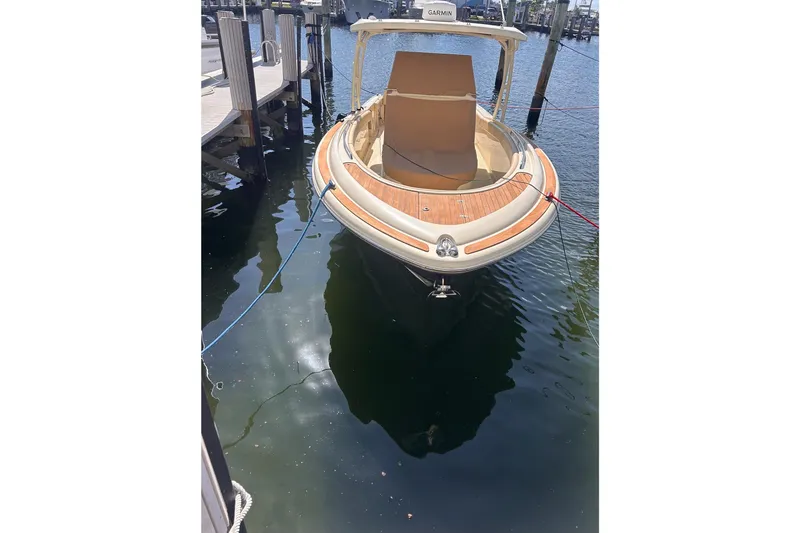  Yacht Photos Pics 2018 Chris-Craft Catalina 30 docked, showcasing elegant design and teak accents.