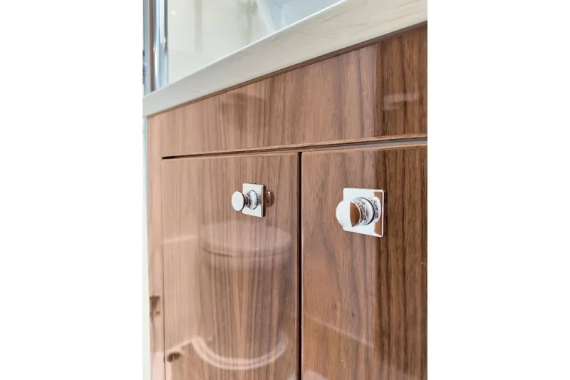  Yacht Photos Pics Wooden cabinet with chrome handles in 2020 Riviera 4800 Sport Yacht interior.