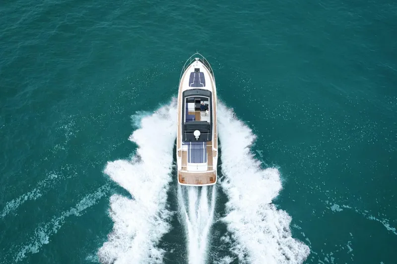New For 2026 Yacht Photos Pics 2026 Fairline Targa 50 Open yacht cruising on open sea, aerial view.