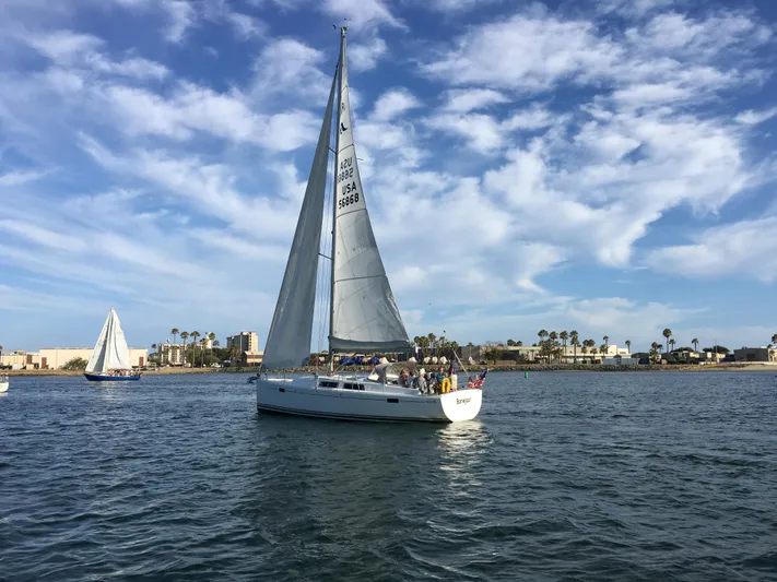 Bonejour Yacht Photos Pics Sailboat Hanse 385 (2012) cruising on a sunny day with blue skies.