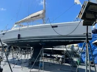 Bonejour Yacht Photos Pics Hanse 385 sailboat from 2012 on dry dock, with clear blue sky background.