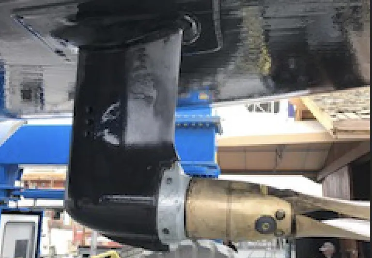 Bonejour Yacht Photos Pics Close-up of a 2012 Hanse 385 sailboat rudder and propeller in a shipyard.