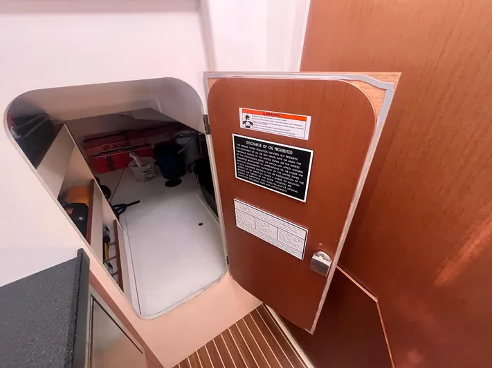 Bonejour Yacht Photos Pics Interior of 2012 Hanse 385 yacht showing open door to storage area.