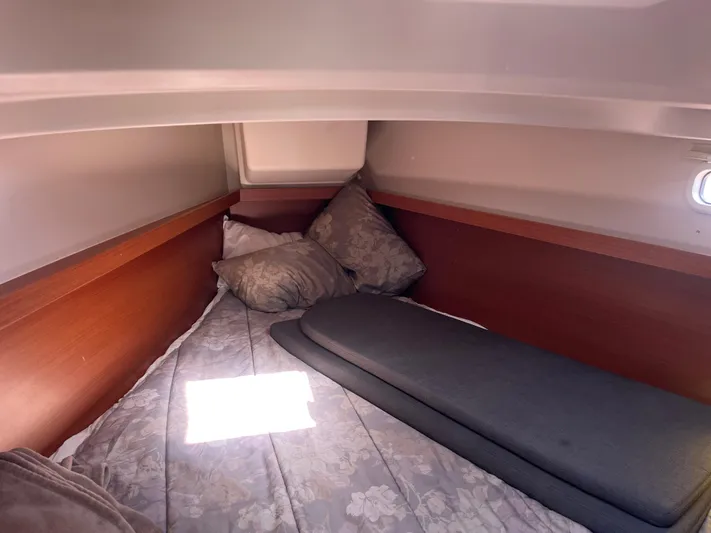 Bonejour Yacht Photos Pics Cozy cabin interior of 2012 Hanse 385 sailboat with bedding and cushions.