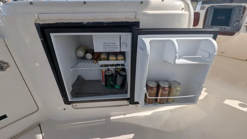 Anna Leeza Yacht Photos Pics Open mini fridge on 2004 Meridian 408 Motor Yacht, stocked with beverages.