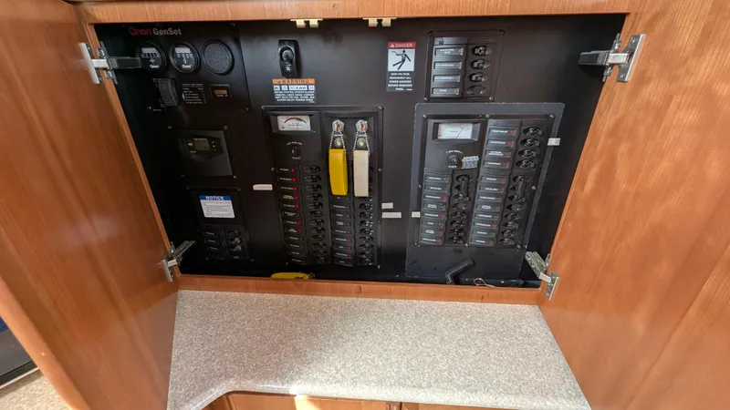 Anna Leeza Yacht Photos Pics Electrical panel inside 2004 Meridian 408 Motor Yacht, featuring circuit breakers and controls.