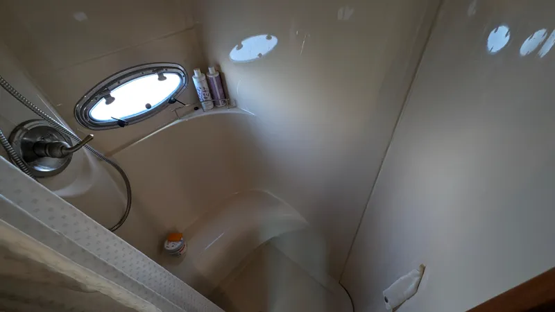 Anna Leeza Yacht Photos Pics Shower area in 2004 Meridian 408 Motor Yacht with porthole and toiletries.