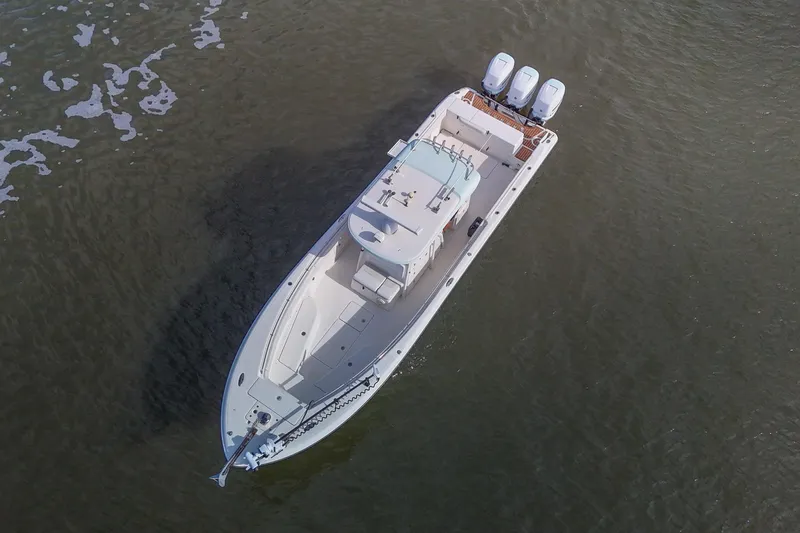  Yacht Photos Pics Aerial view of 2008 Triton 351 CC boat on open water.