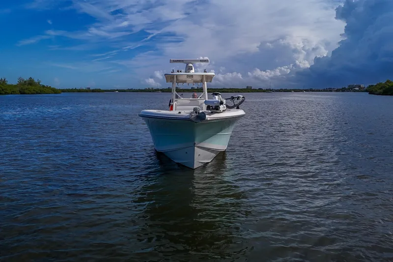  Yacht Photos Pics 2008 Triton 351 CC boat on calm water under a partly cloudy sky.