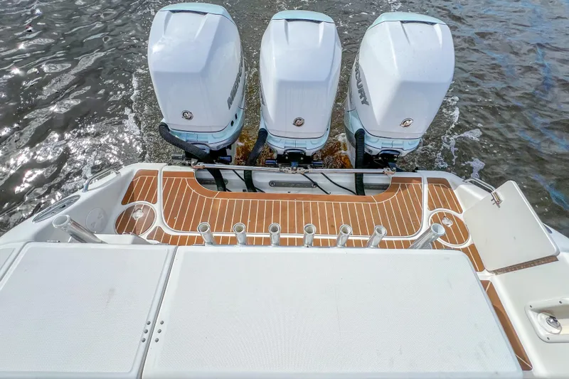  Yacht Photos Pics 2008 Triton 351 CC boat with three Mercury outboard engines on water.