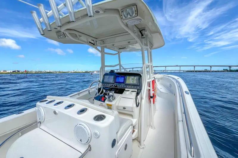  Yacht Photos Pics 2008 Triton 351 CC boat on open water, featuring a modern helm and clear blue skies.