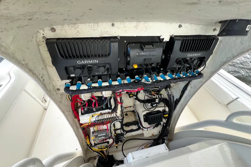  Yacht Photos Pics 2008 Triton 351 CC boat electronics panel with Garmin devices and wiring.