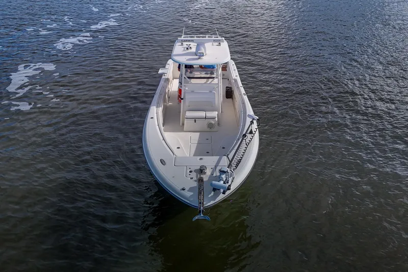  Yacht Photos Pics 2008 Triton 351 CC boat on calm water, aerial view.