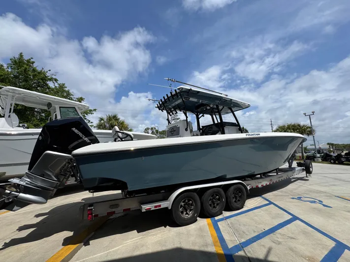  Yacht Photos Pics 2021 Fountain 38TE boat on trailer under blue sky.