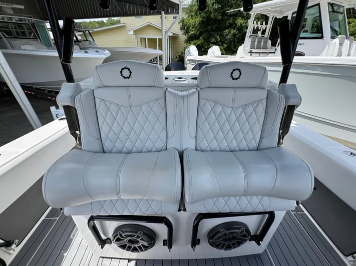  Yacht Photos Pics 2021 Fountain 38TE boat interior with luxurious quilted seating and built-in speakers.