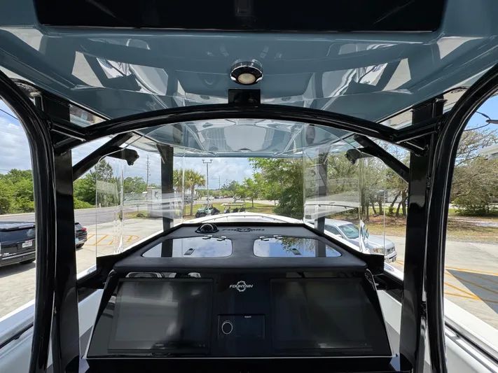  Yacht Photos Pics Interior view of 2021 Fountain 38TE boat cockpit with modern navigation system.
