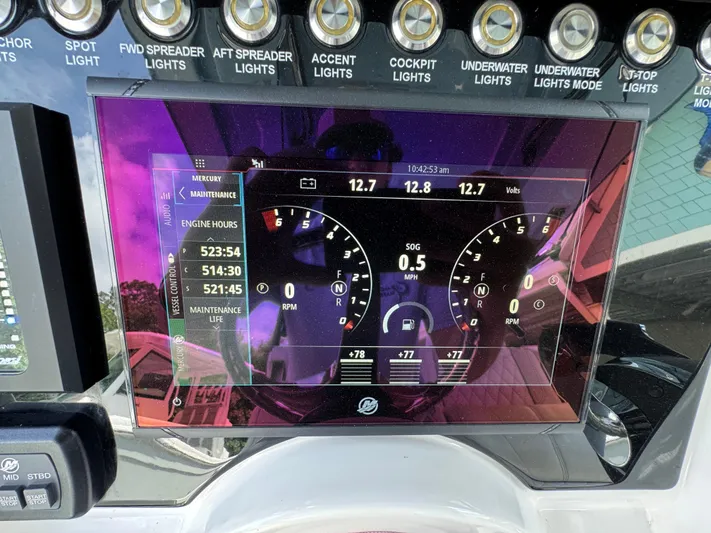 Yacht Photos Pics Dashboard of a 2021 Fountain 38TE boat displaying engine metrics and light controls.