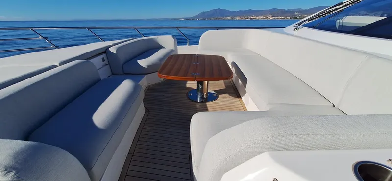 Nassara Yacht Photos Pics Luxurious seating area on 2023 Azimut 78 yacht with ocean view.