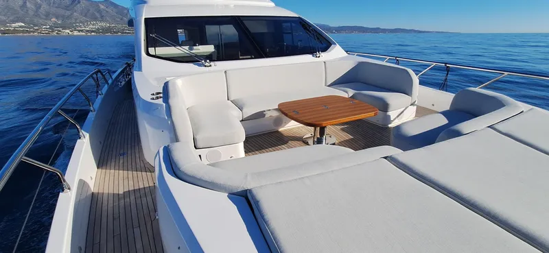 Nassara Yacht Photos Pics 2023 Azimut 78 yacht with spacious deck seating and ocean view.