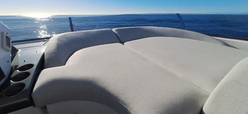 Nassara Yacht Photos Pics 2023 Azimut 78 yacht with luxurious sunbed overlooking the ocean.