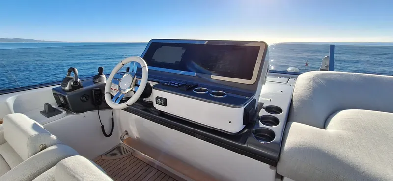 Nassara Yacht Photos Pics 2023 Azimut 78 yacht helm with ocean view, featuring modern controls and seating.
