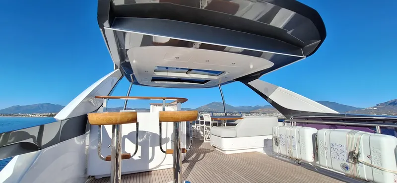 Nassara Yacht Photos Pics Luxurious 2023 Azimut 78 yacht deck with bar stools and panoramic views.