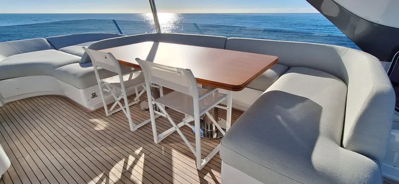 Nassara Yacht Photos Pics Luxury Azimut 78 yacht deck with elegant seating and ocean view, 2023 model.