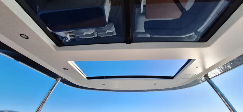 Nassara Yacht Photos Pics Rooftop view of 2023 Azimut 78 yacht with open sky and sleek design.