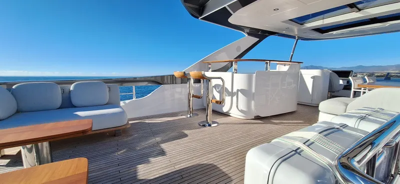 Nassara Yacht Photos Pics Luxurious 2023 Azimut 78 yacht deck with elegant seating and ocean view.