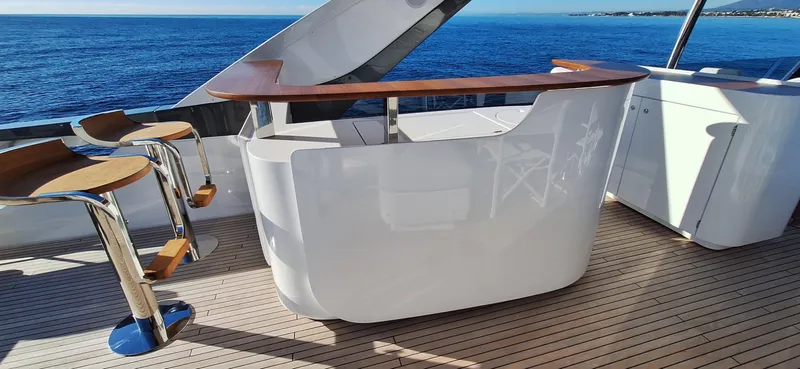 Nassara Yacht Photos Pics Luxurious Azimut 78 yacht deck with sleek bar and ocean view, 2023 model.