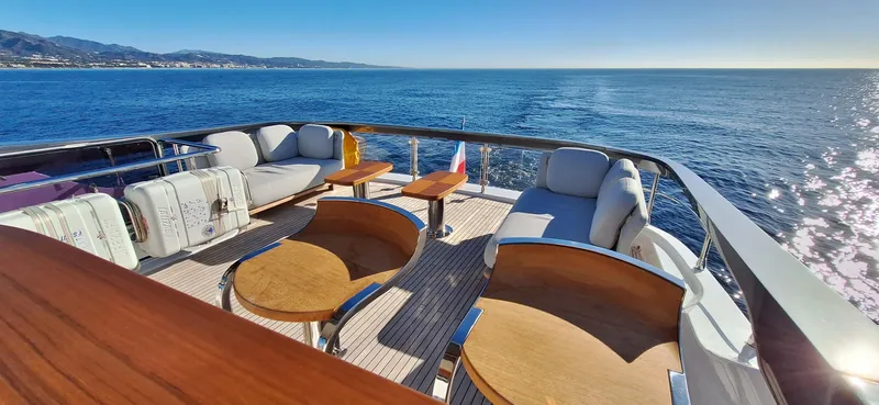 Nassara Yacht Photos Pics Luxurious 2023 Azimut 78 yacht deck with elegant seating, overlooking serene ocean views.