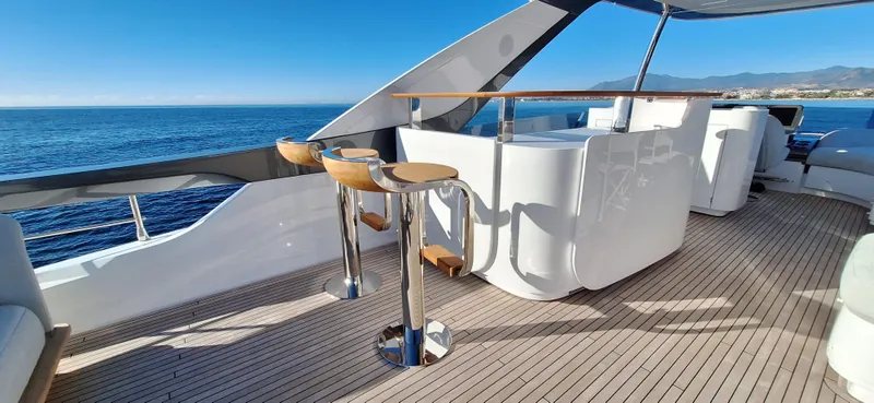 Nassara Yacht Photos Pics Luxurious Azimut 78 yacht deck with bar stools, overlooking the ocean, 2023 model.