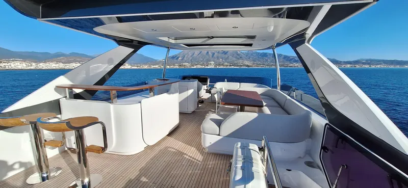 Nassara Yacht Photos Pics Luxurious 2023 Azimut 78 yacht interior with elegant seating and ocean view.