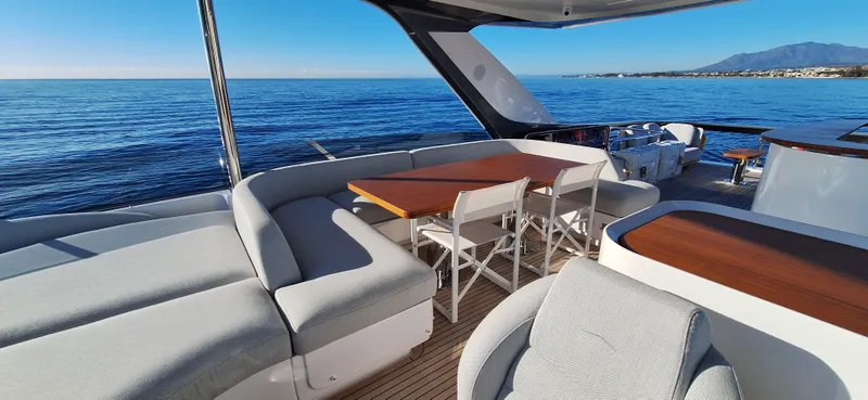 Nassara Yacht Photos Pics Luxurious 2023 Azimut 78 yacht deck with elegant seating and ocean view.