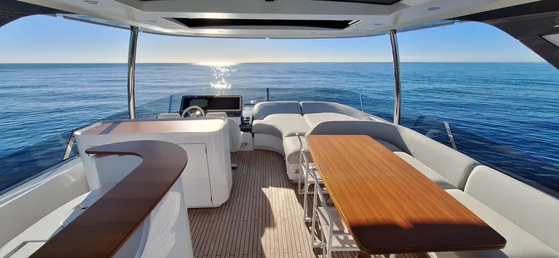 Nassara Yacht Photos Pics Luxurious 2023 Azimut 78 yacht interior with elegant seating and ocean view.