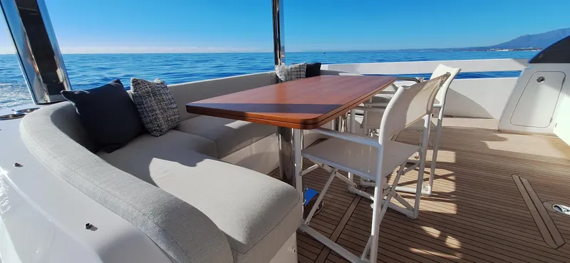 Nassara Yacht Photos Pics Luxurious 2023 Azimut 78 yacht deck with elegant seating and ocean view.