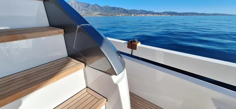 Nassara Yacht Photos Pics Staircase on 2023 Azimut 78 yacht with ocean and mountain view.