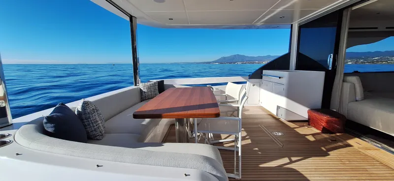 Nassara Yacht Photos Pics Luxurious 2023 Azimut 78 yacht deck with elegant seating and ocean view.