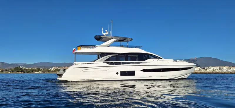 Nassara Yacht Photos Pics 2023 Azimut 78 yacht cruising on calm waters under a clear blue sky.