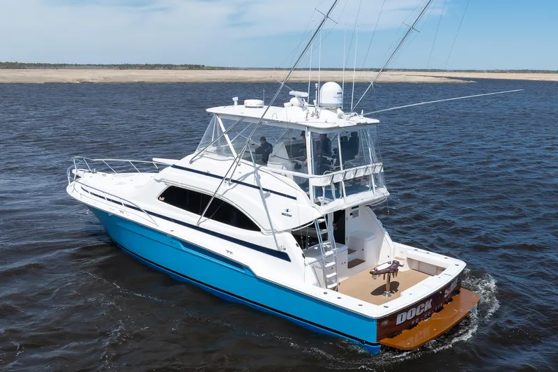 Dock Side Yacht Photos Pics 2007 Bertram 570 Convertible yacht cruising on open water.