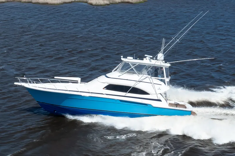 Dock Side Yacht Photos Pics 2007 Bertram 570 Convertible yacht cruising on open water.