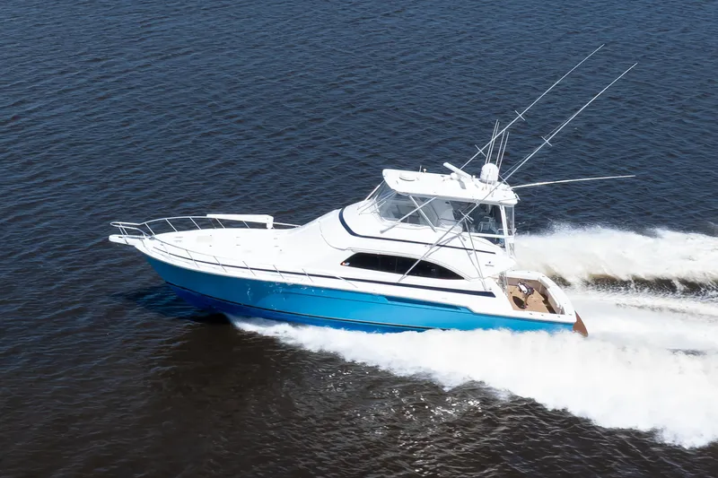 Dock Side Yacht Photos Pics 2007 Bertram 570 Convertible yacht cruising on open water.